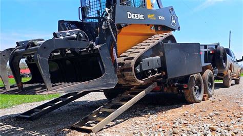 load a dump truck with a mini skid steer|7x12 dump trailer skid steer.